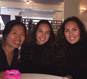 image of Bei with family sitting in a restaurant